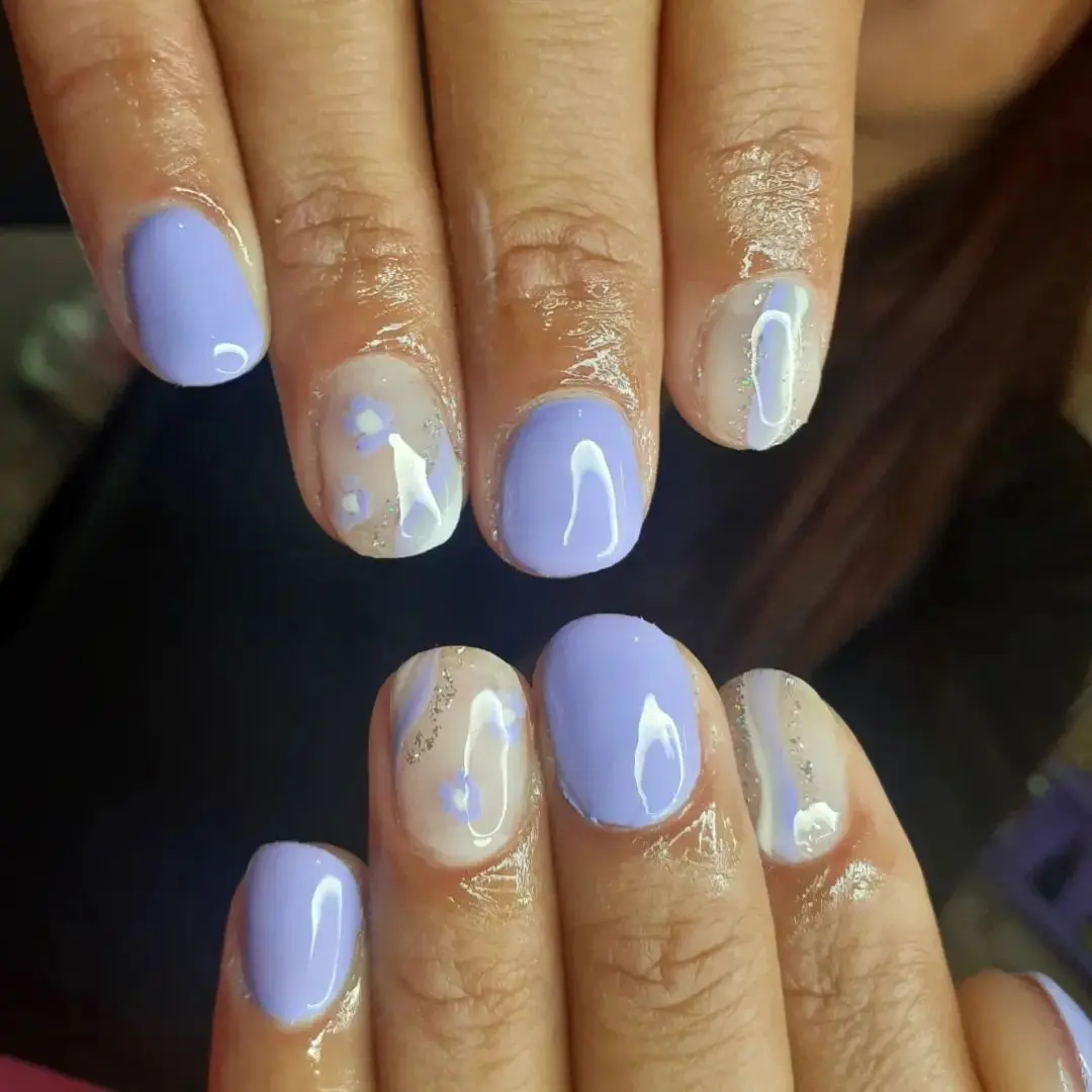Sky blue oval nails featuring minimalist thin white line art for a sophisticated touch.