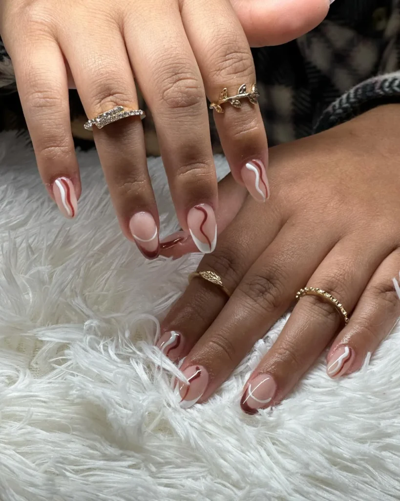 ivory almond nails with a solid cocoa brown accent nail