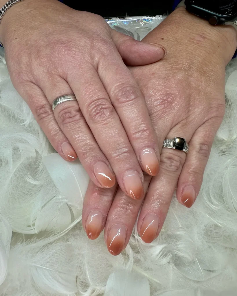 terracotta to rust ombre almond nails with a smooth gradient