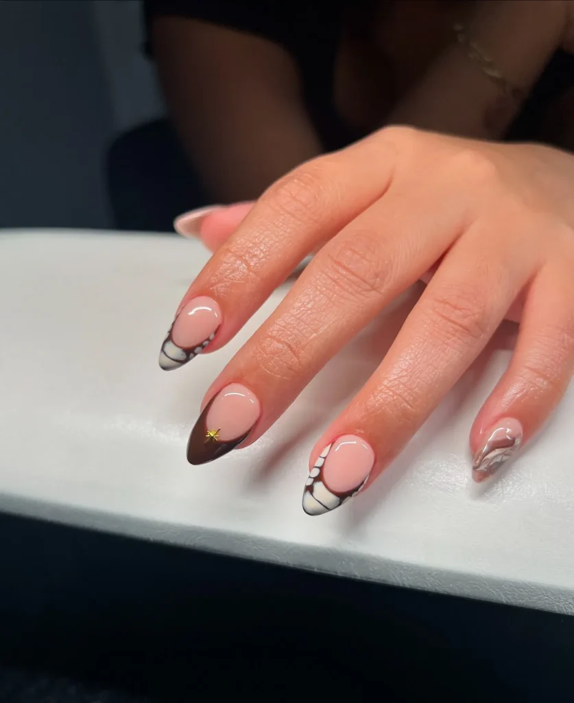 French tip almond nails with a warm brown line instead of white
