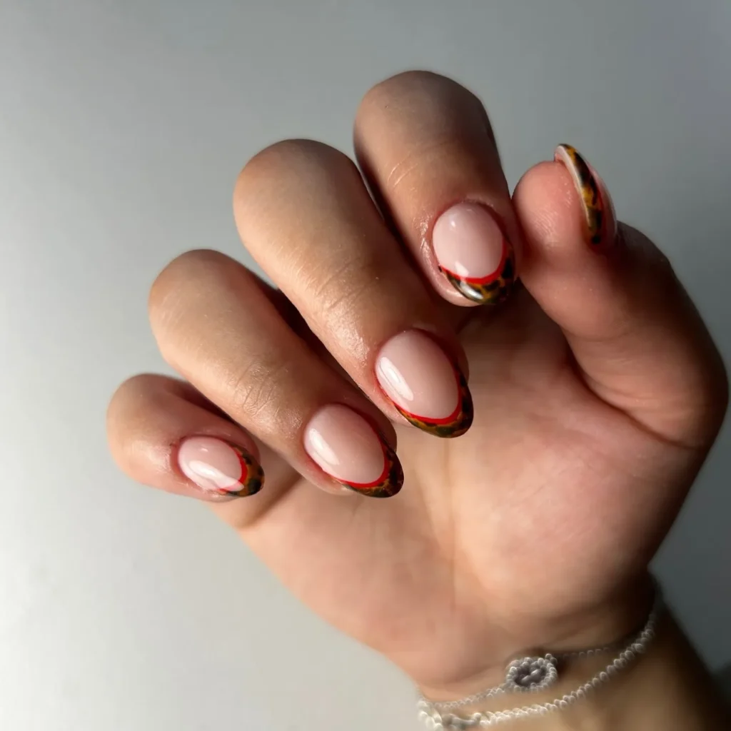 French tip almond nails with a hand-painted sunflower accent nail