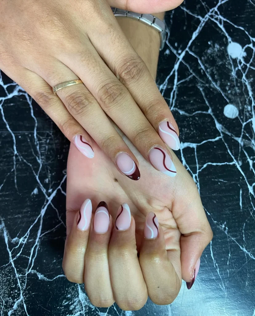 creamy white and warm brown swirl almond nails for fall
