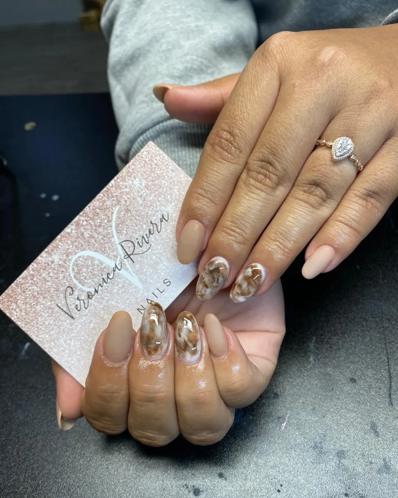 marbled brown almond nails with stone-like veined texture