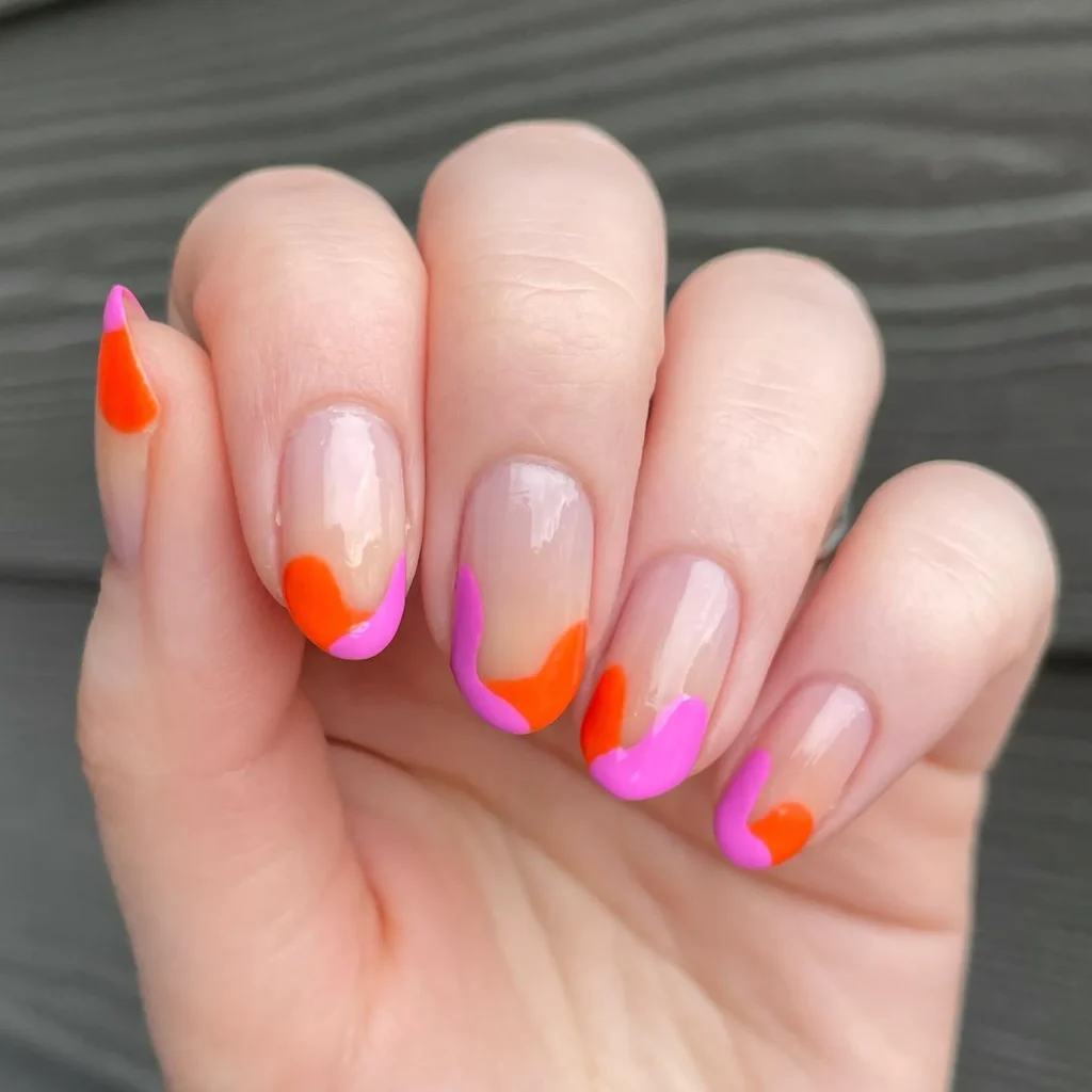 saturated orange and pink gradient almond nails