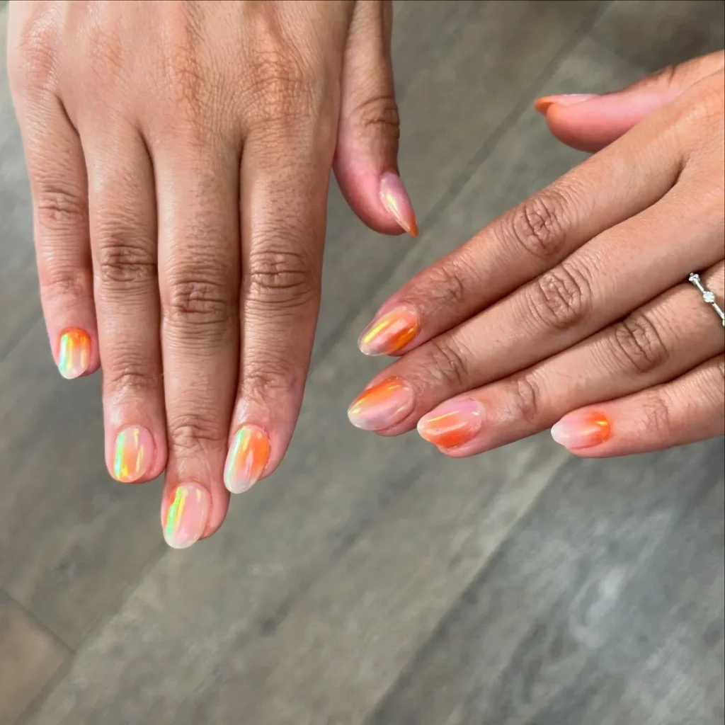 orange chrome finish on solid almond nails