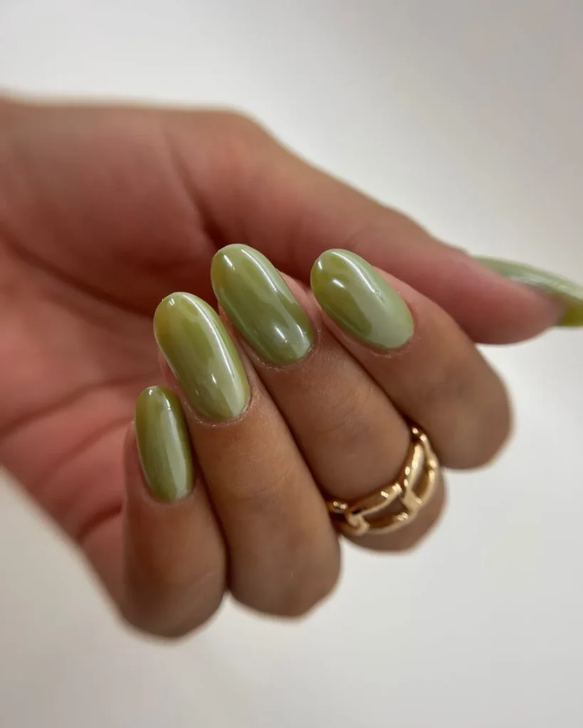 muted sage olive almond nails in a satin finish