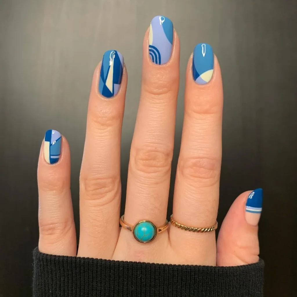 geometric gold christmas almond nails