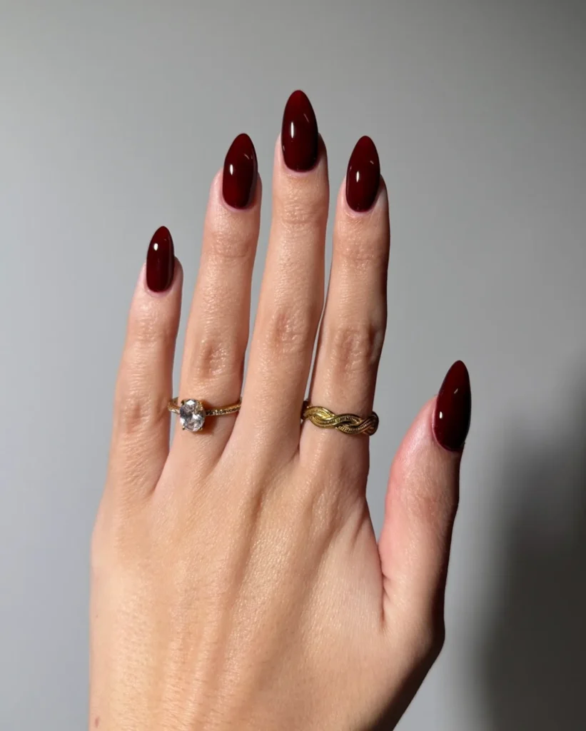 deep burgundy glossy solid almond nails for fall