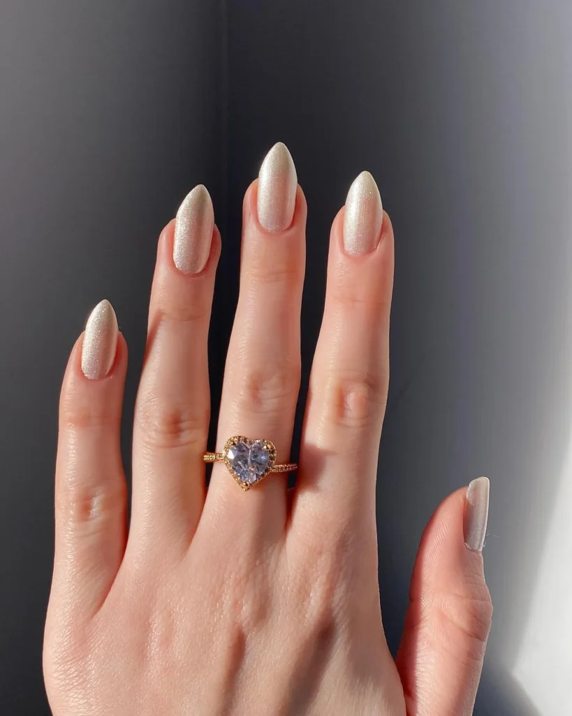 white christmas almond nails with gold foil accent
