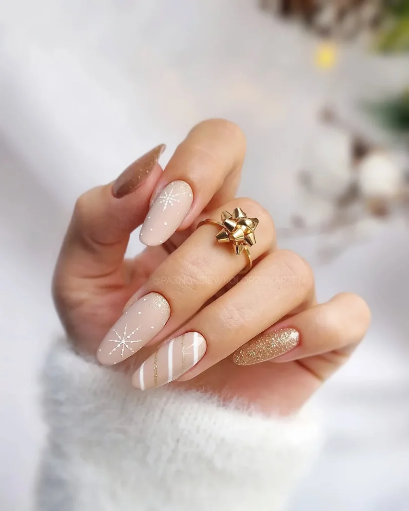 beige christmas almond nails with snowflake patterns