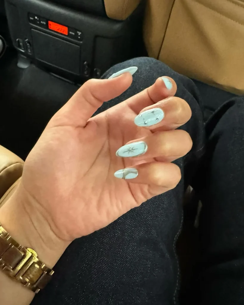 icy blue christmas almond nails with snowflakes