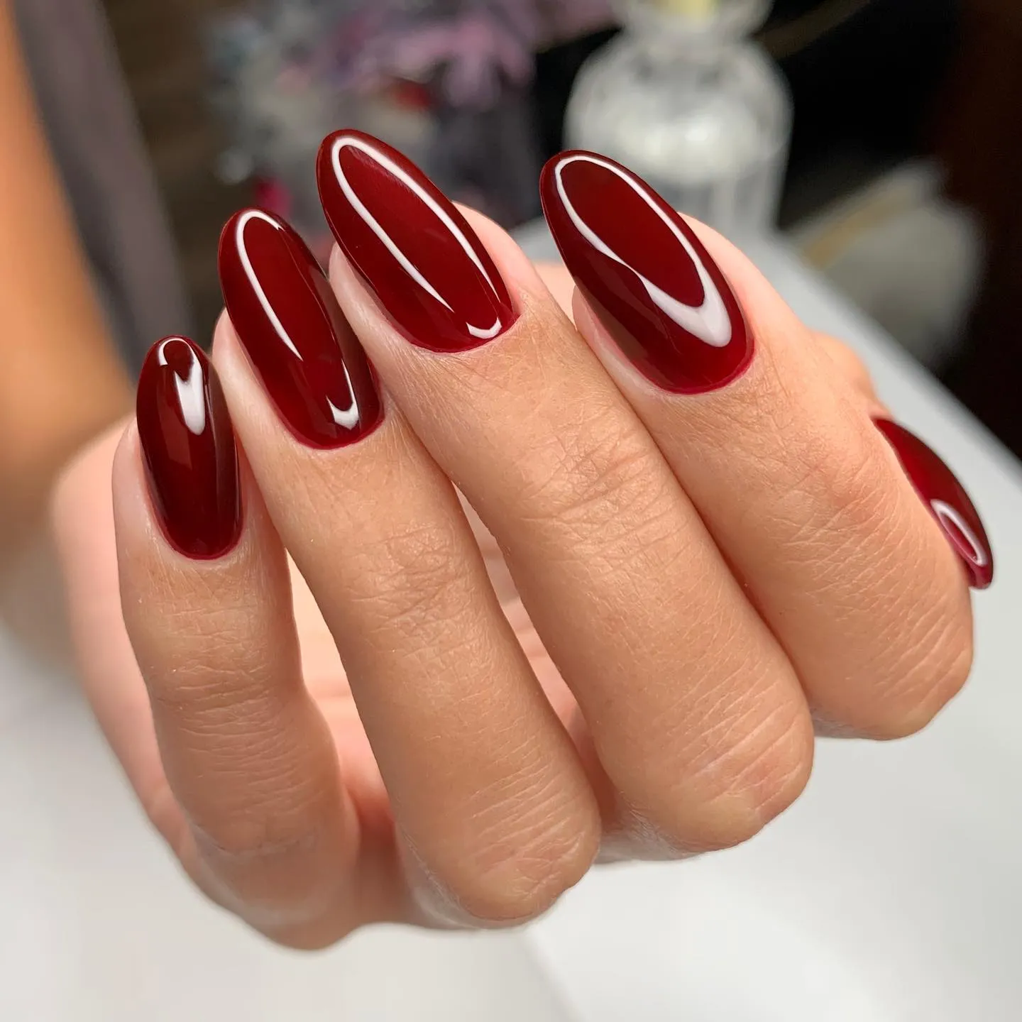 Glossy Burgundy Almond Nails