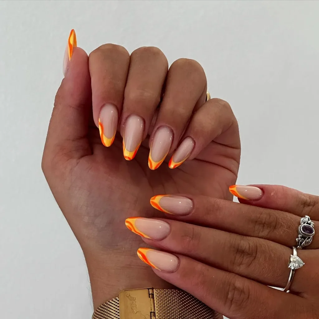 deep rust-orange glossy almond nails
