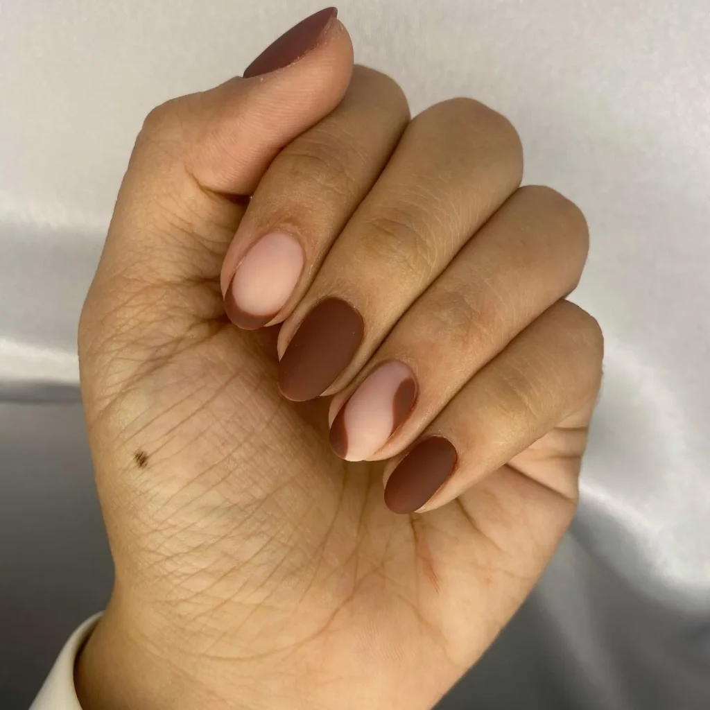 matte chocolate brown almond nails with a velvet finish