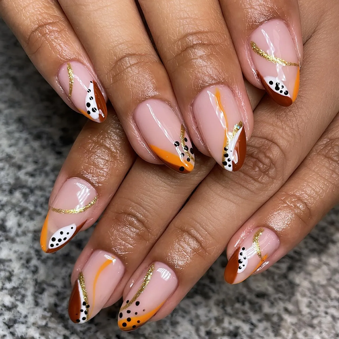 Nude Almond with Leopard Print and Orange Accents Nails