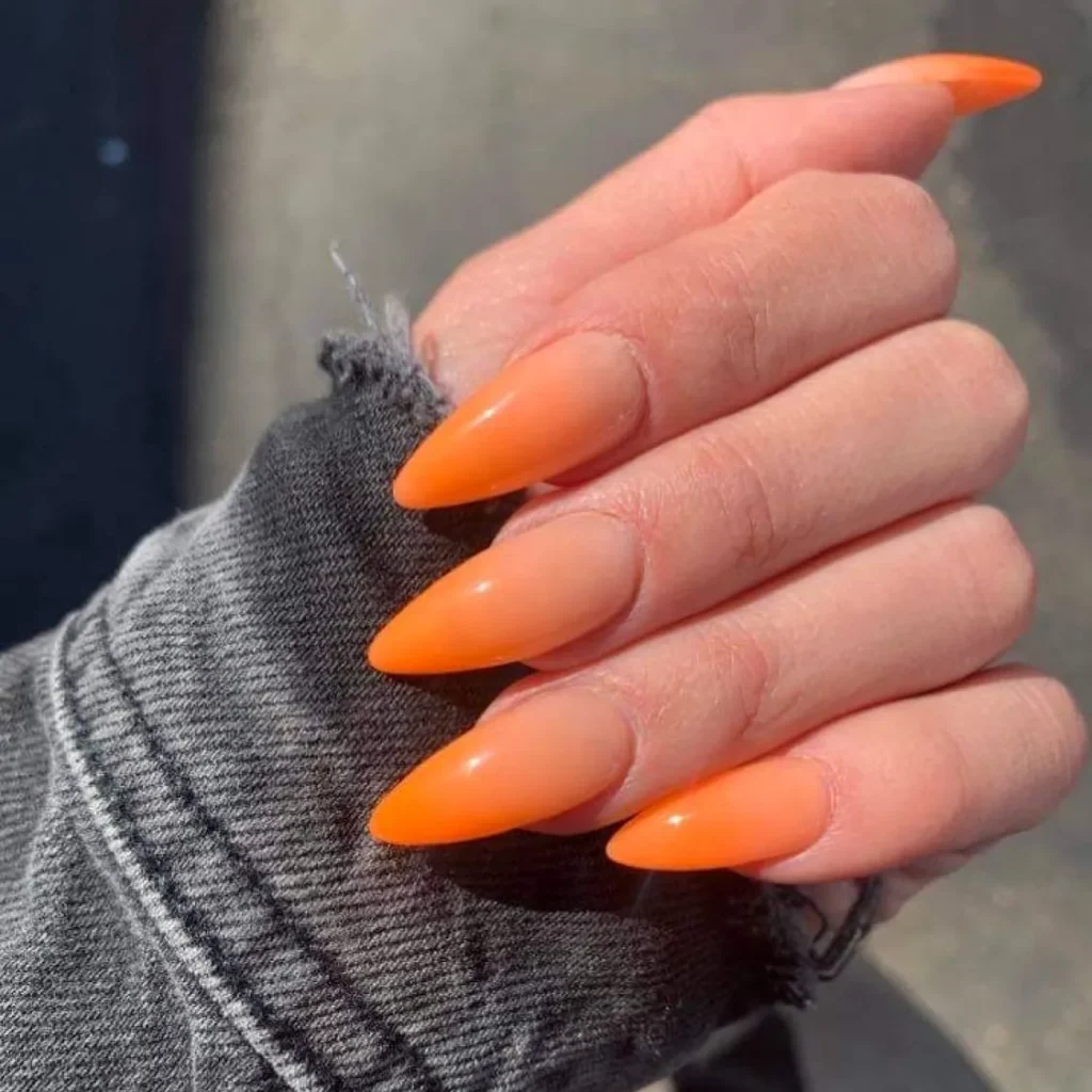 vibrant multi-tone orange ombre almond nails
