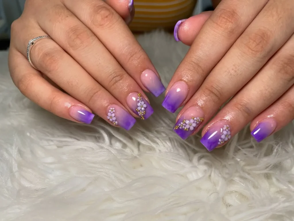 rhinestone purple French tip almond nails with added sparkle