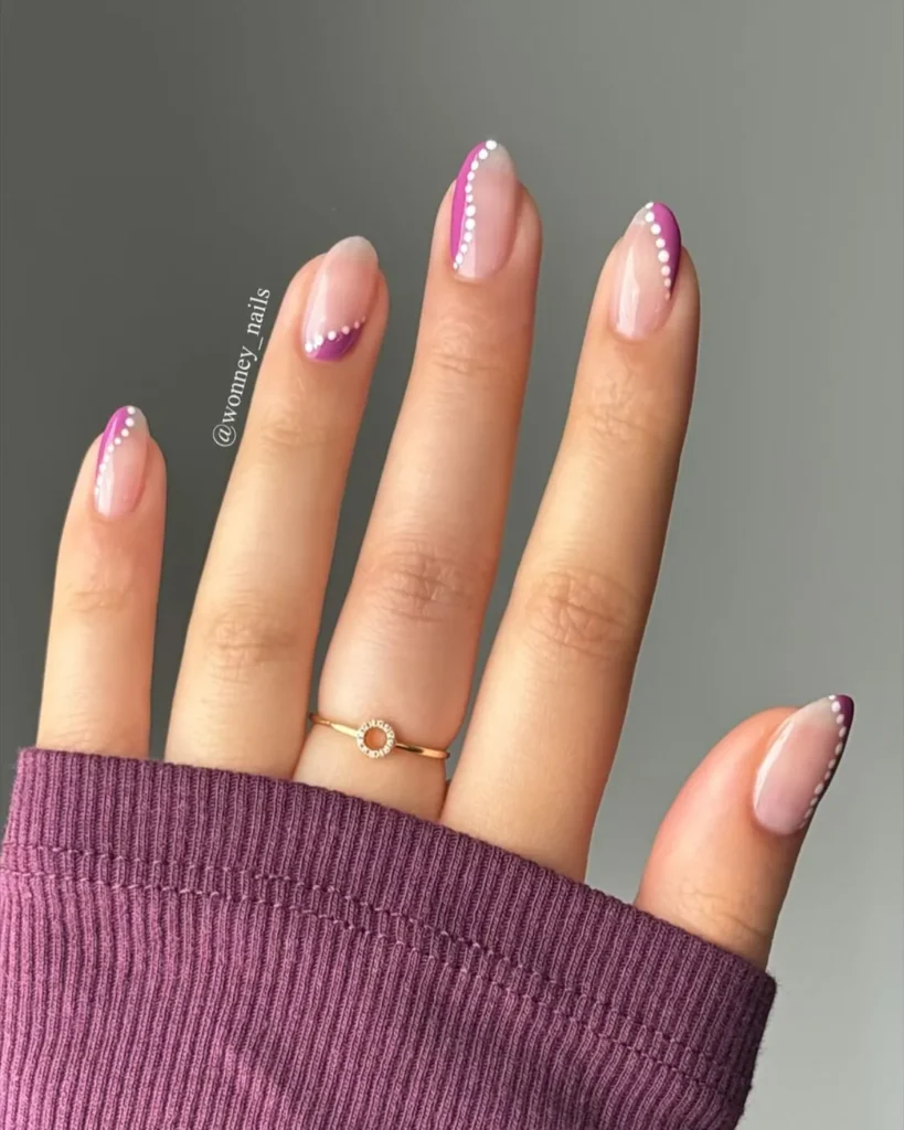 purple swirl almond nails with a hand-painted accent