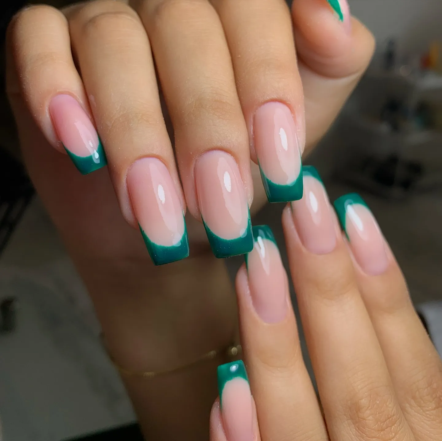 Dark Green French Tip Nails with a Glossy Finish