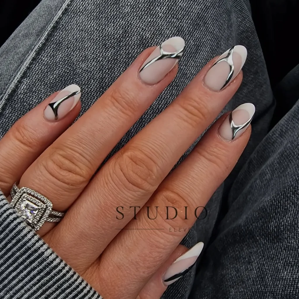 matte almond nails with a metallic silver accent nail