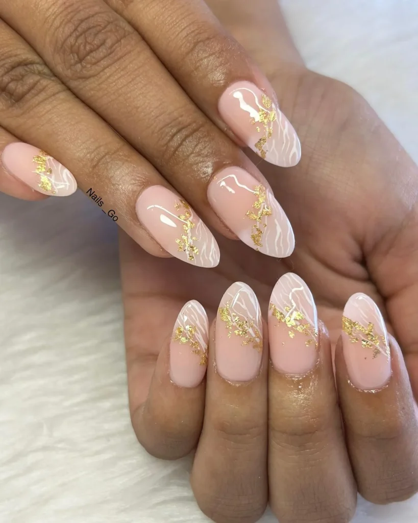 nude long almond nails with gold foil marble accent