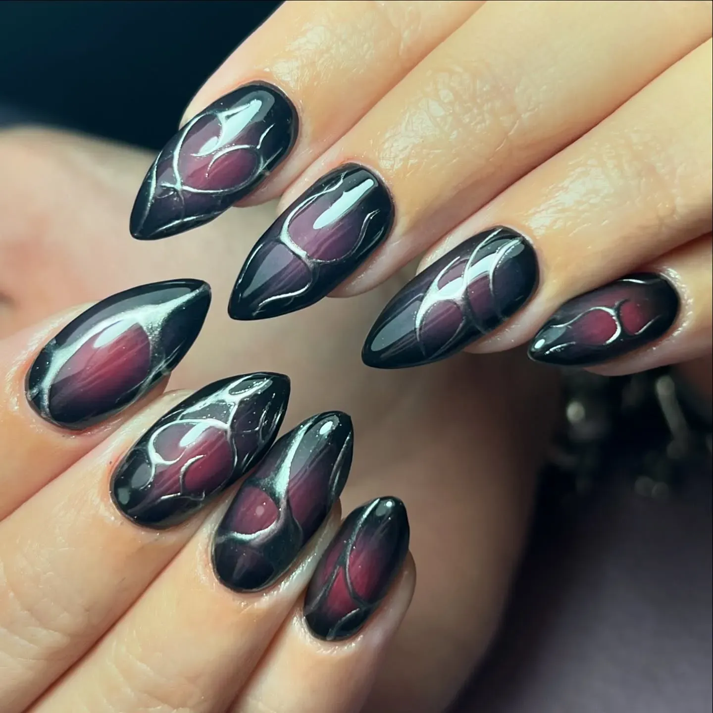 Black Chrome Almond with Red Shimmer Nails