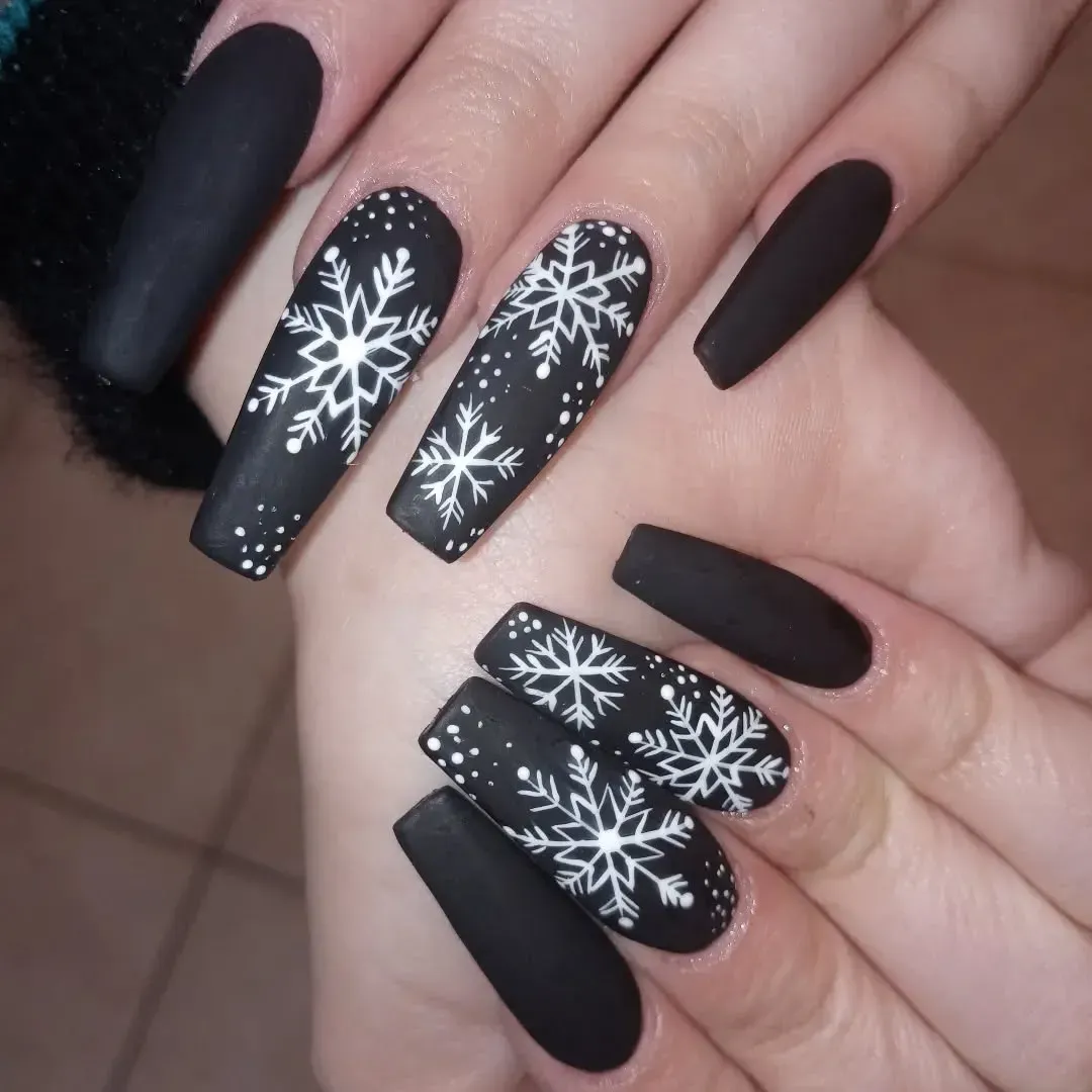Matte black coffin nails with white snowflakes