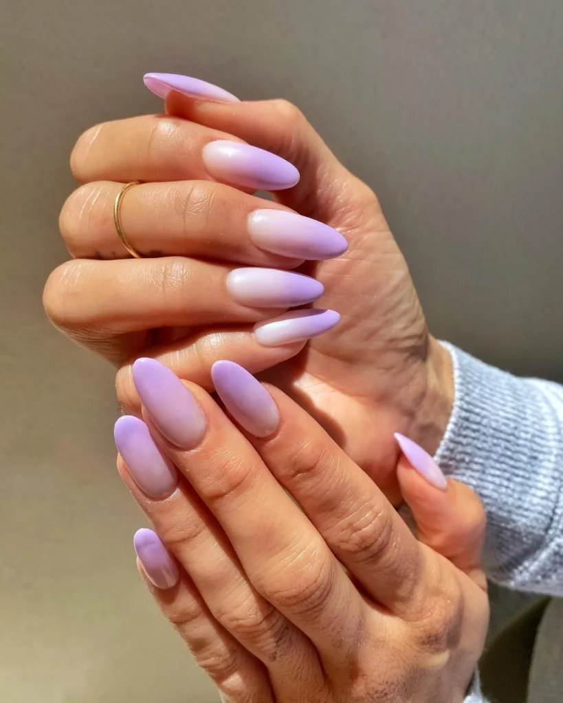 purple and white chrome almond nails with a graphic finish