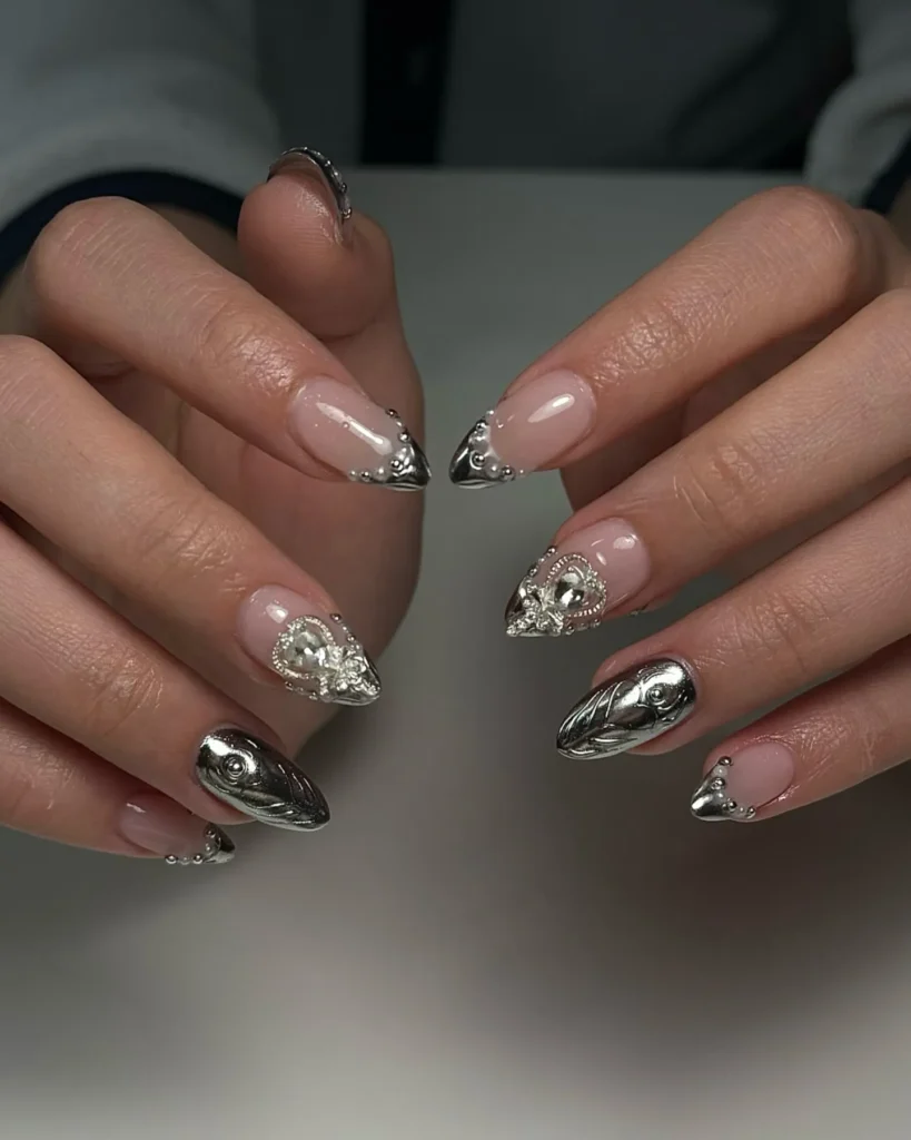 silver glitter almond nails with tiny hand-painted heart accents