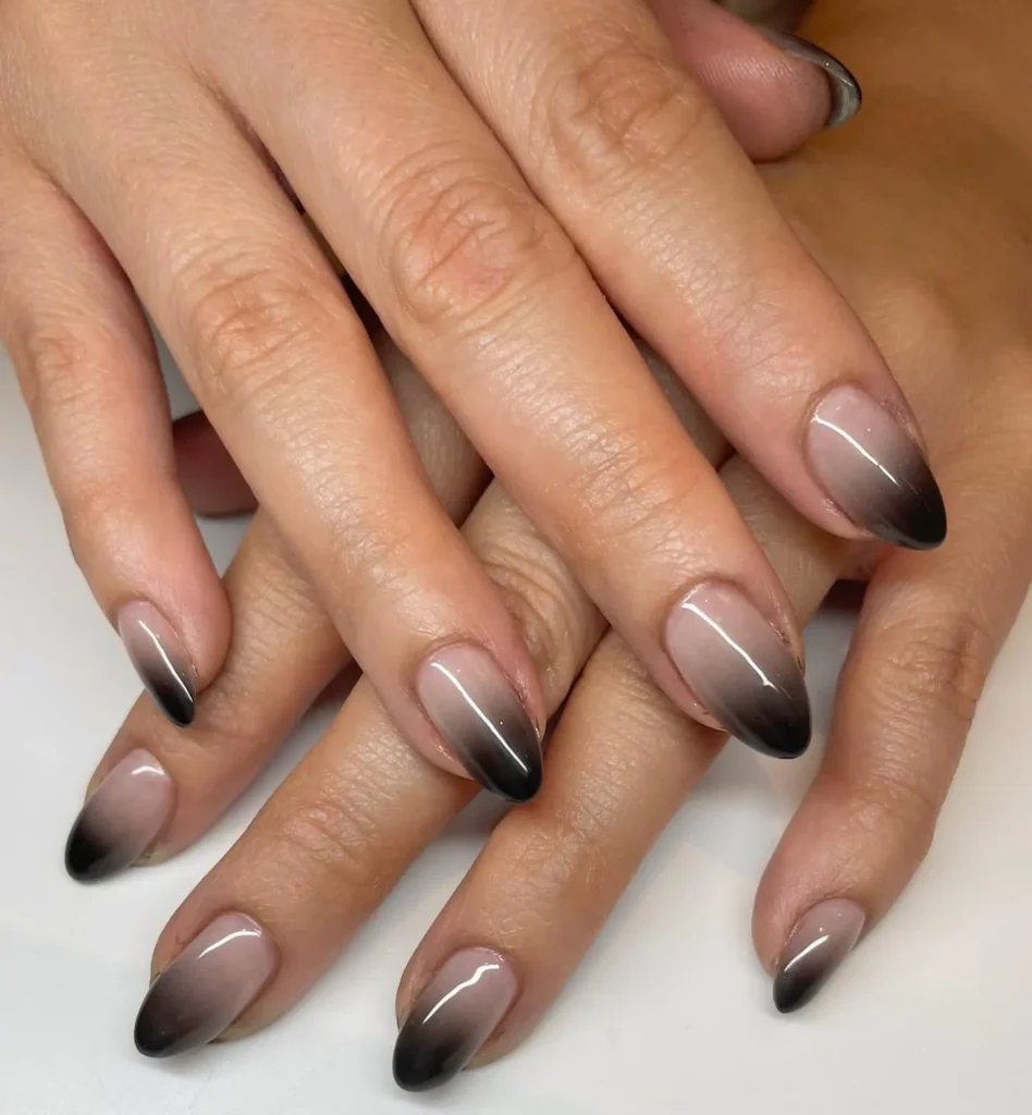 nude to black ombre long sharp almond nails