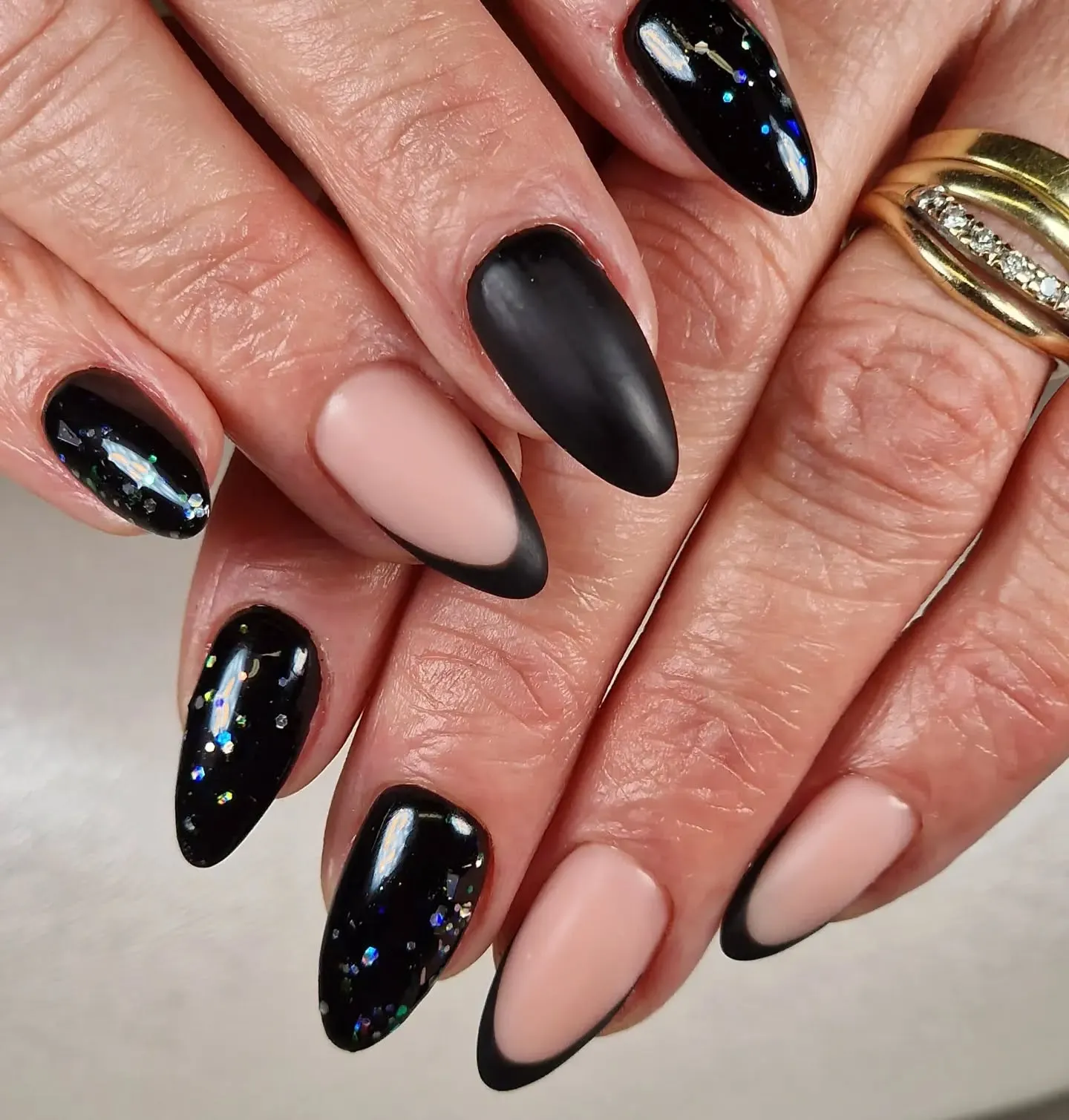Stunning Matte Black and Gold Chrome Nails