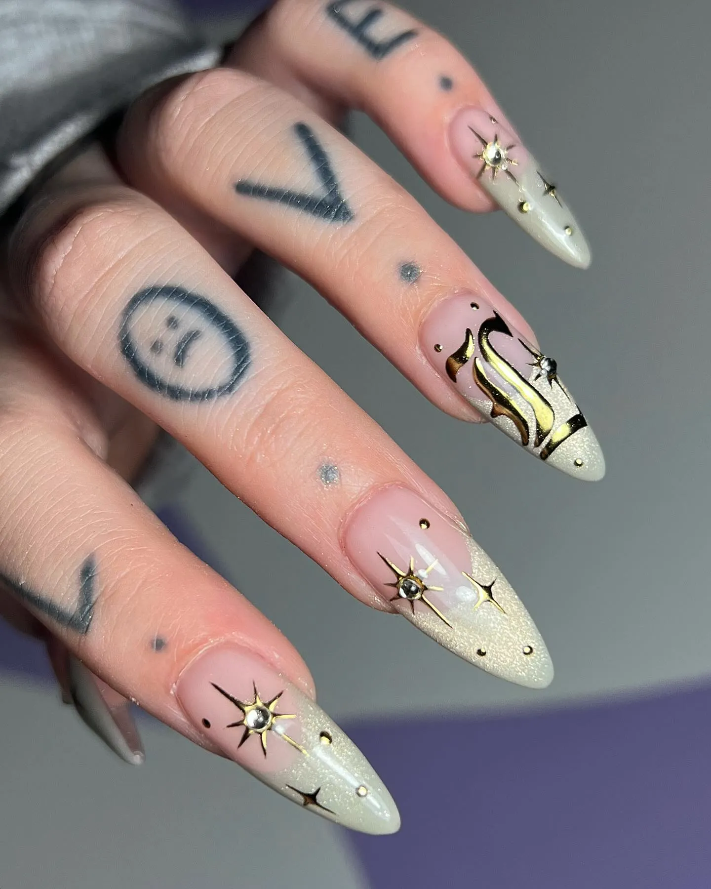 Edgy Rose Gold Goth Nails
