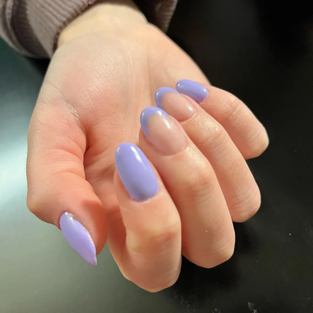 purple French tip almond nails over a sheer nude base