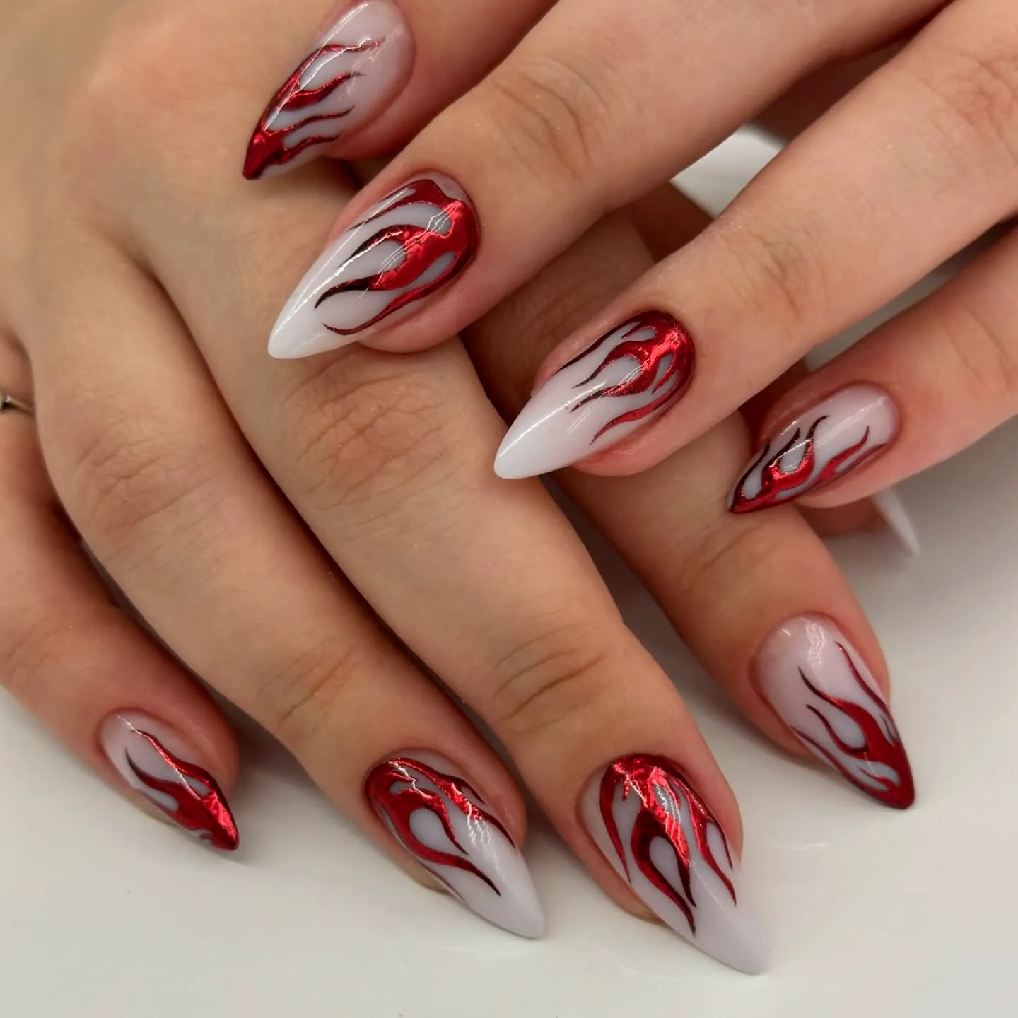 Flame Tips on Stiletto Red Glitter Nails