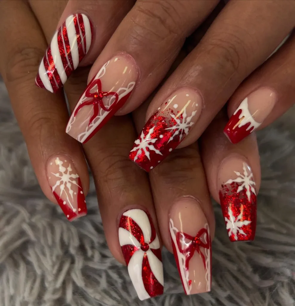 red christmas almond nails with white snowflake linework