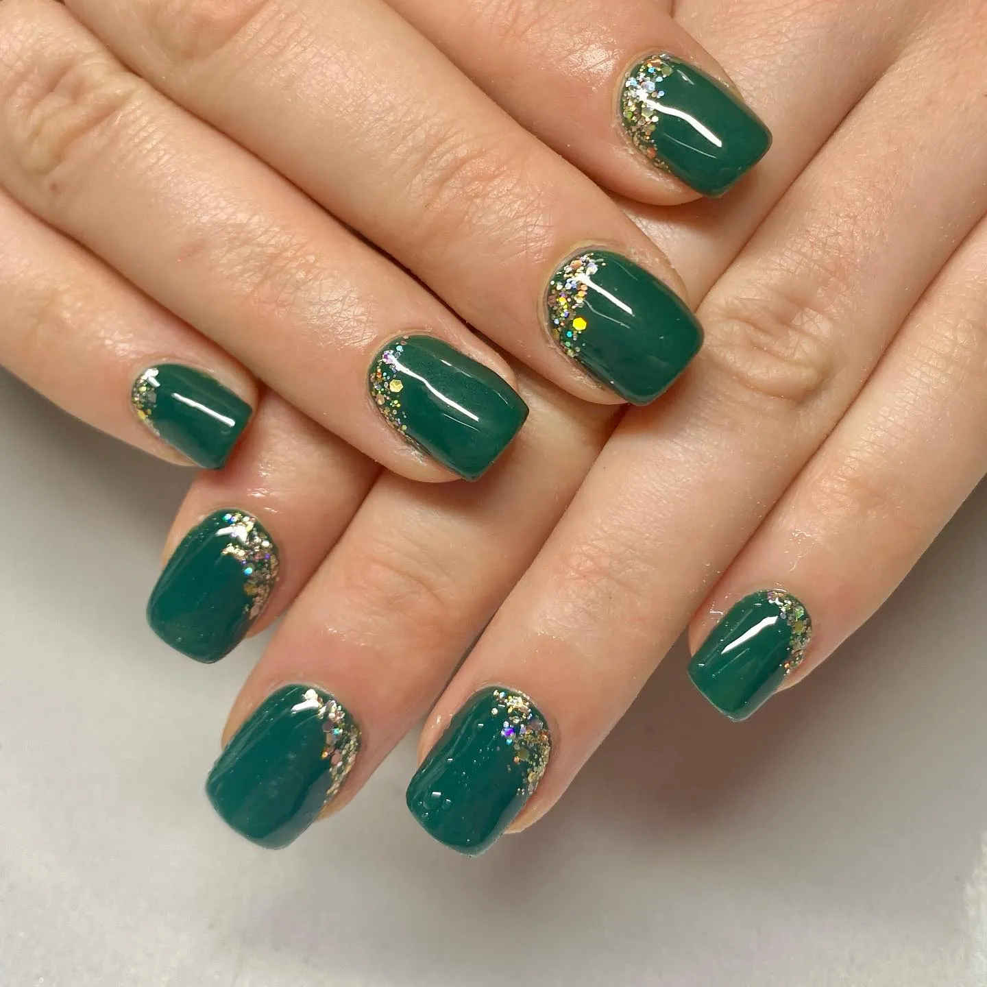 Green nails with gold accents