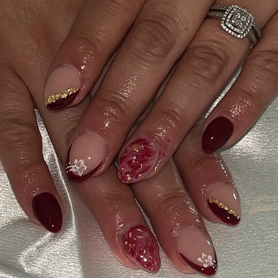 Maroon and gold glitter nails