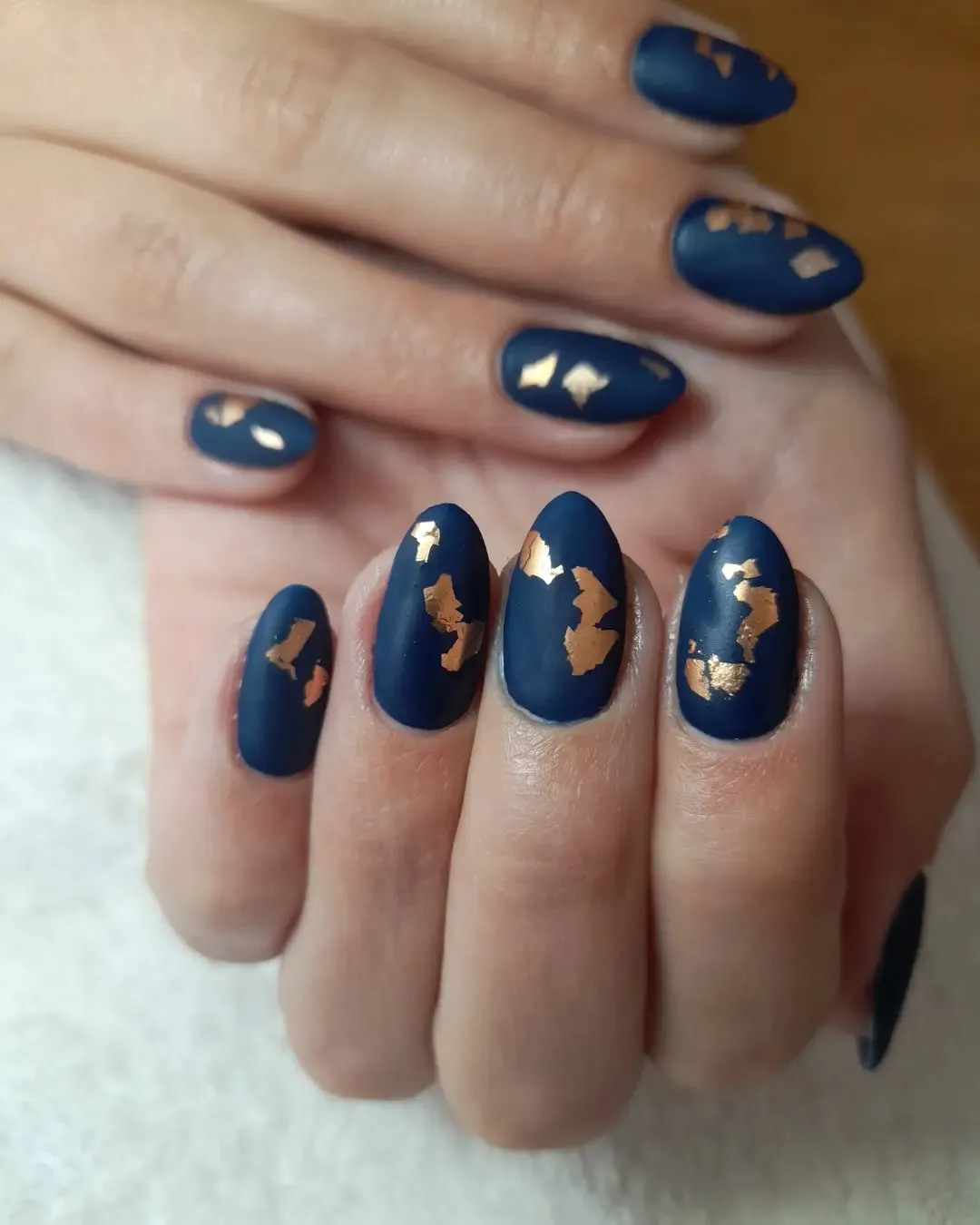 Navy blue and gold nails