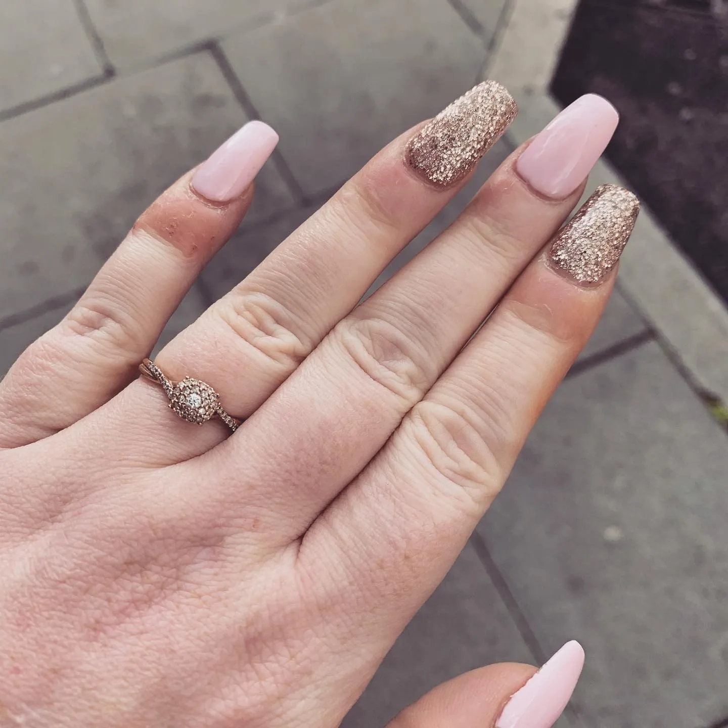 Nude nails with glitter accents