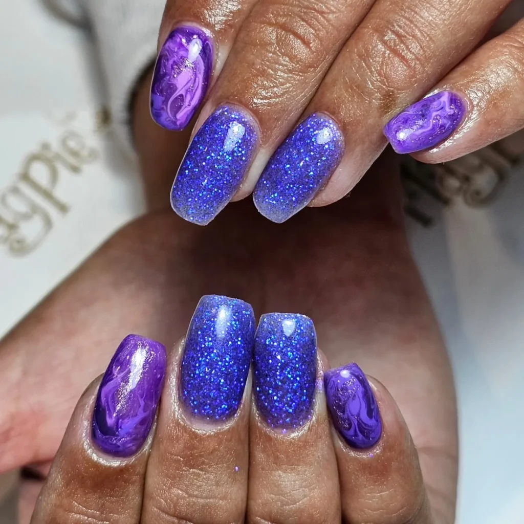 royal purple glitter almond nails with a jewel-toned finish