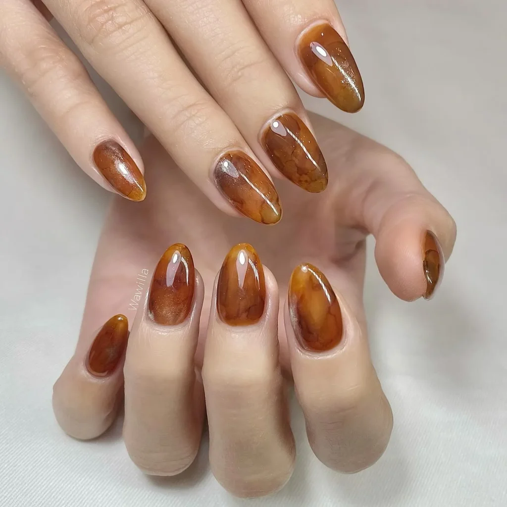 caramel and cream drizzle swirl almond nails