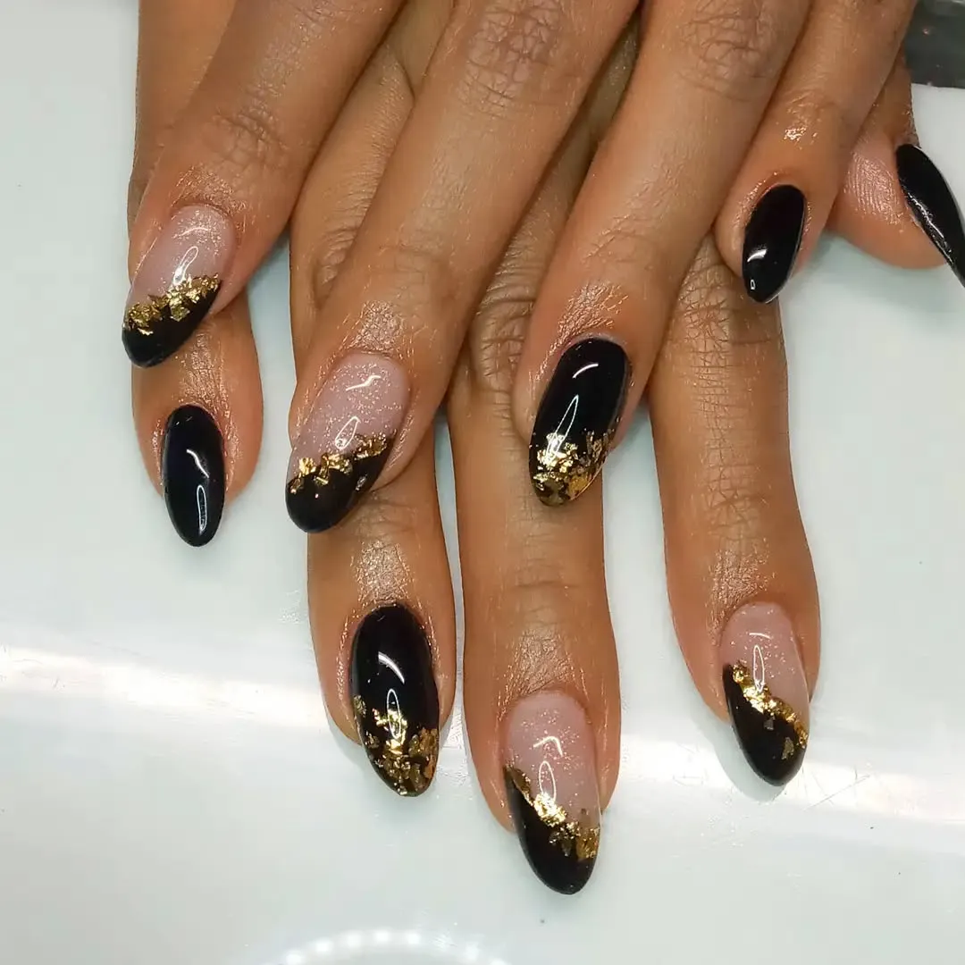 Black nails with gold accents