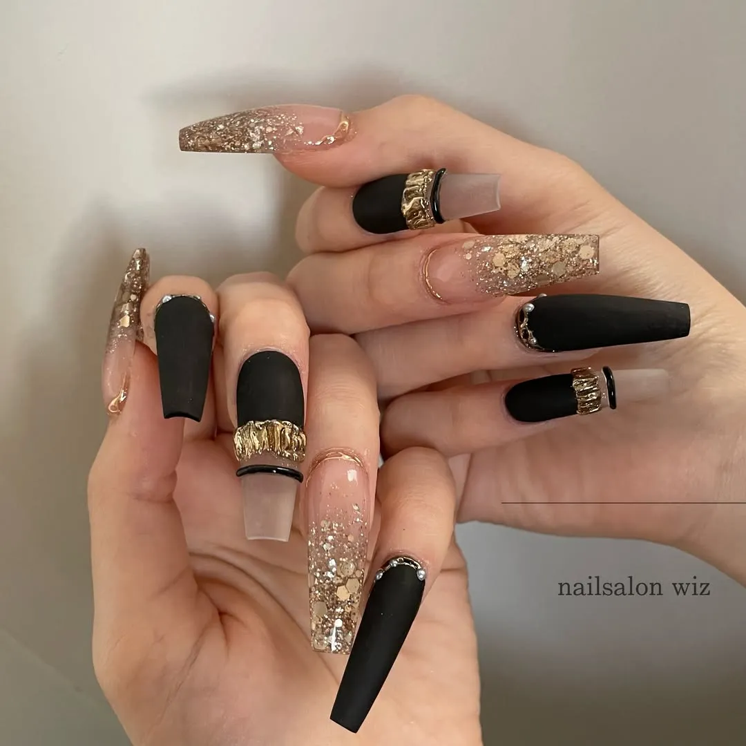 Black Nails with Gold Accents