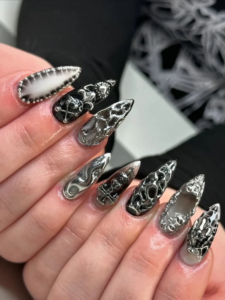 classic black almond nails with a scattering of silver glitter