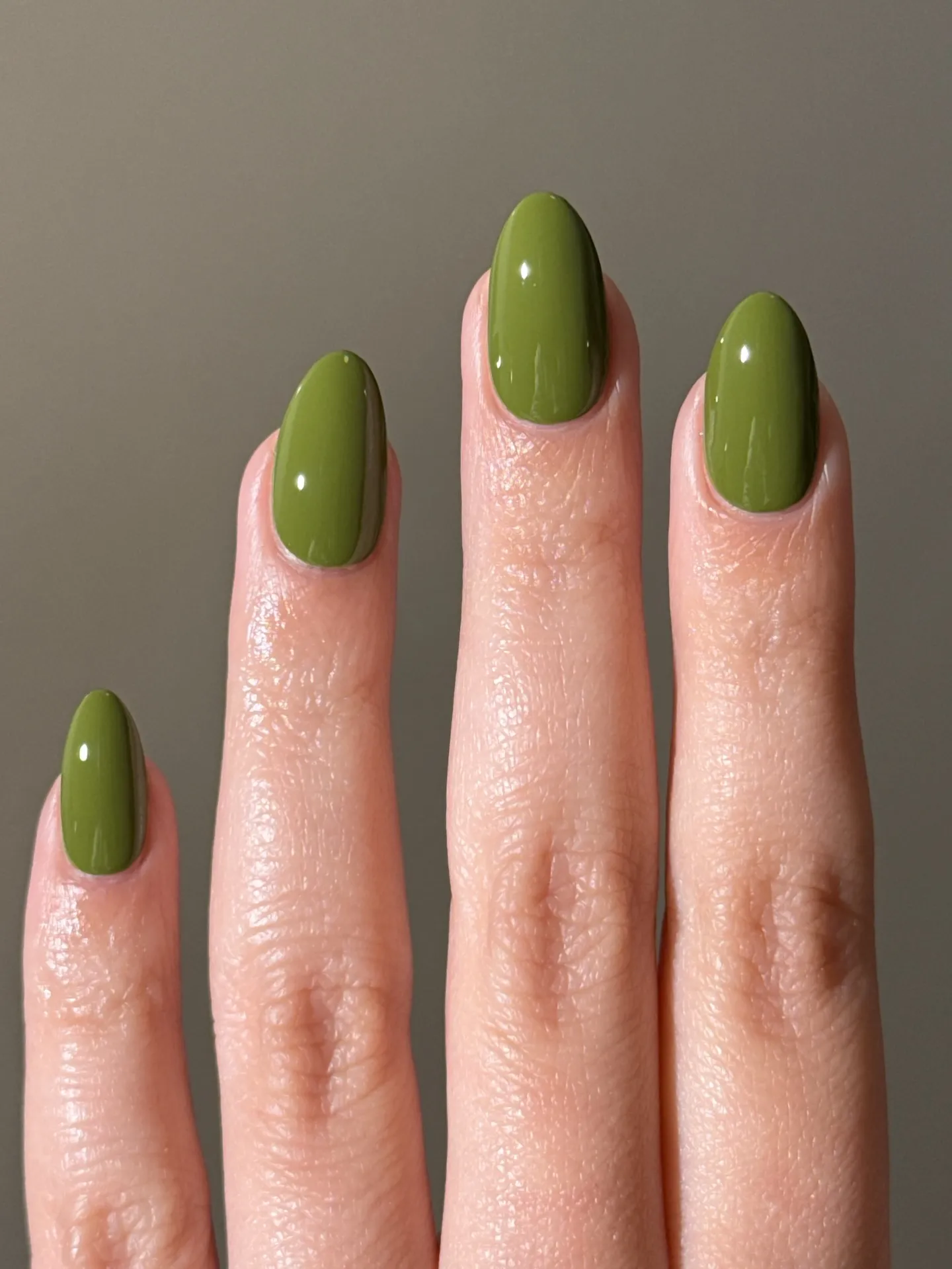 Glossy olive green short oval nails