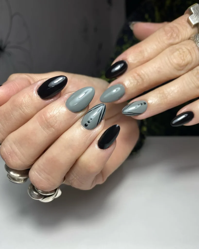 black and gray almond nails with a soft gray accent nail