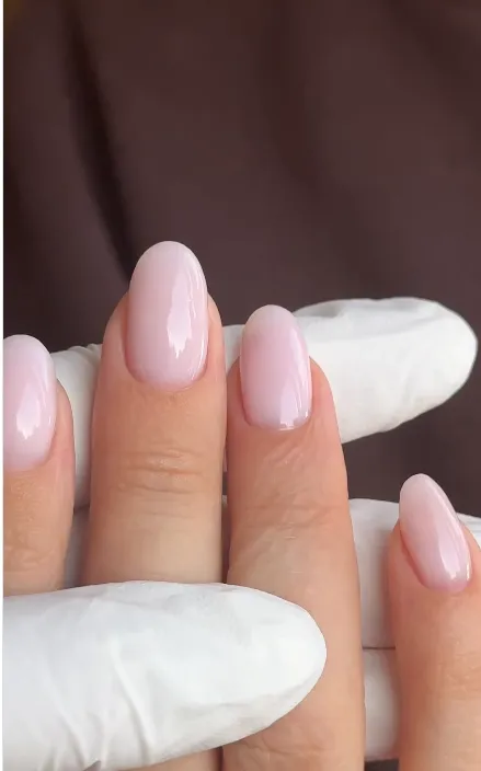 Glossy sheer pale pink short almond nails