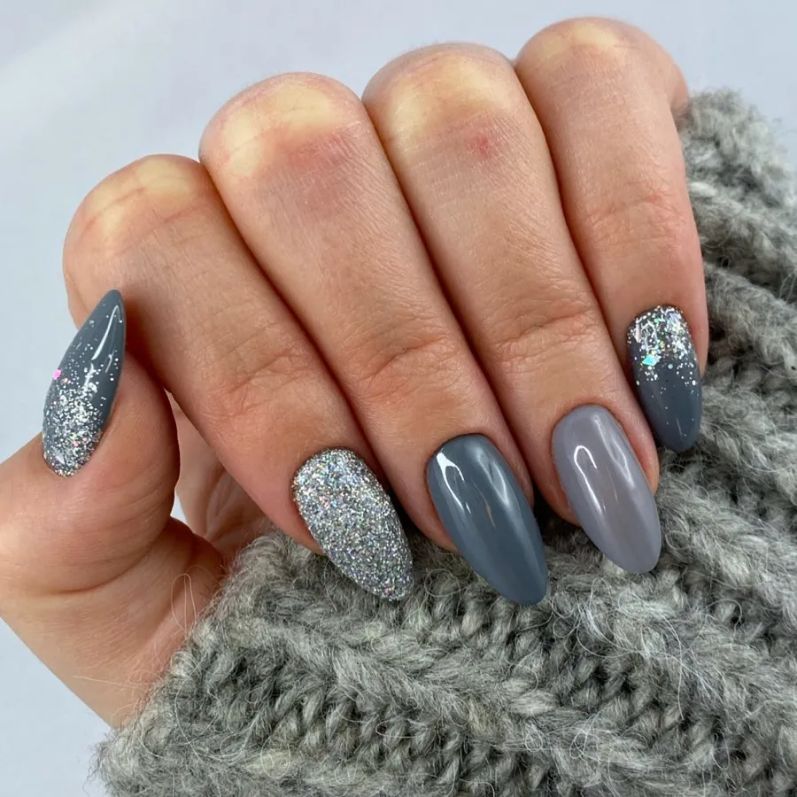 gray winter almond nails with silver glitter accents