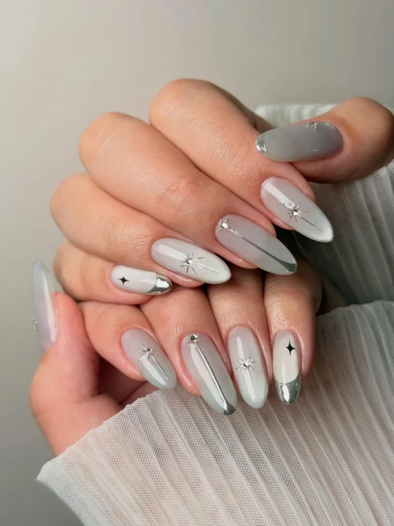 gray magnet-effect almond nails with star accents