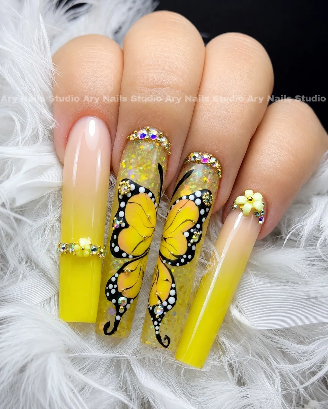 Yellow coffin nails with orange and black monarch butterfly wings